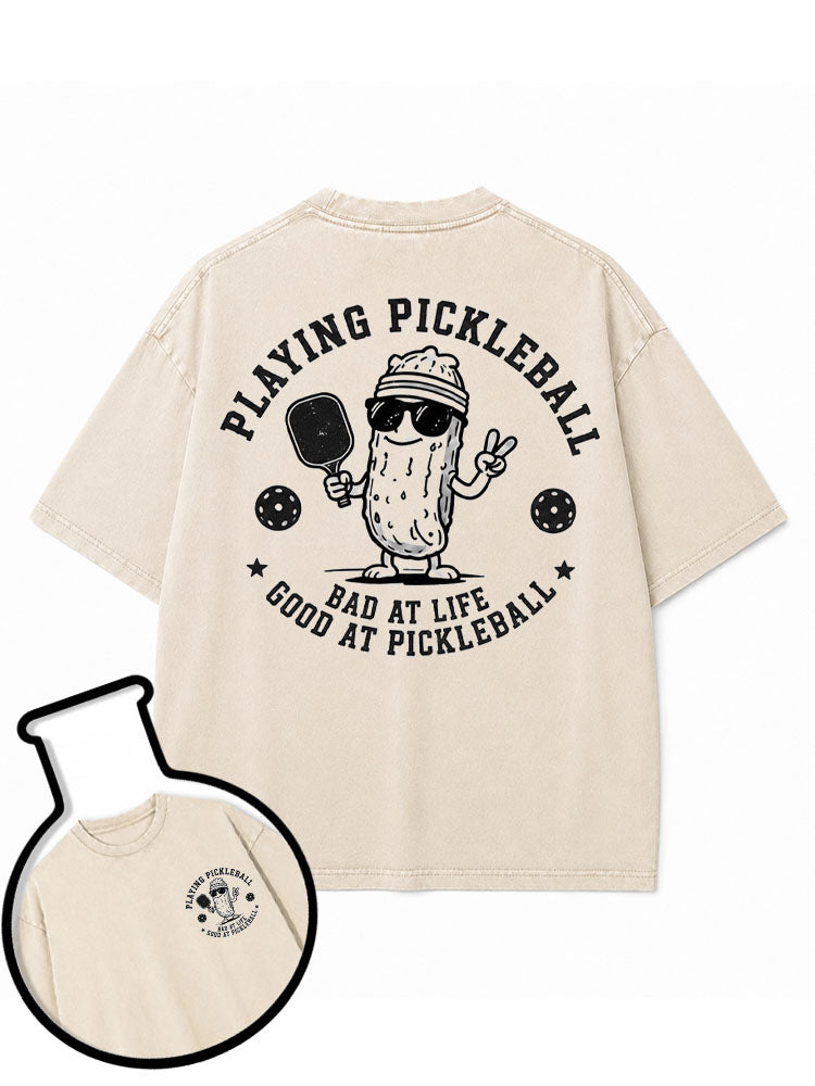 PLAYING PICKLEBALL  BAD AT LIFE GOOD AT PICKLEBALL Washed T-Shirt