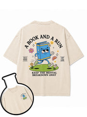 A BOOK AND A RUN KEEP THE MENTAL BREAKDOWN AWAY Washed T-Shirt